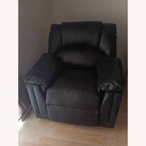 Used Black Leather Ottoman Rocking Recliner Chair for sale on AptDeco