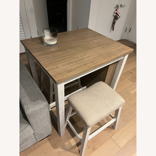 Used Ashley Furniture Skempton Light Brown Wood Dining Table Set for sale on AptDeco