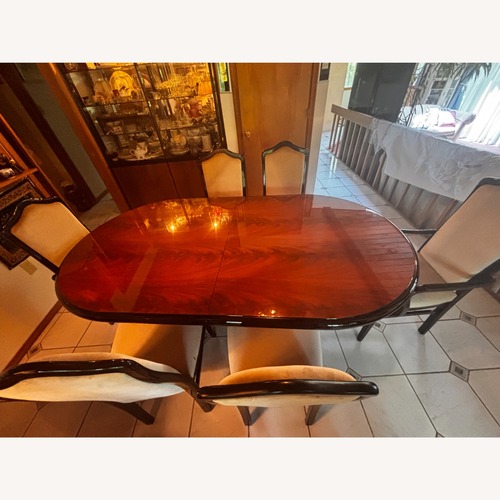 Used Black Wood Dining Set W 6 Chairs  for sale on AptDeco