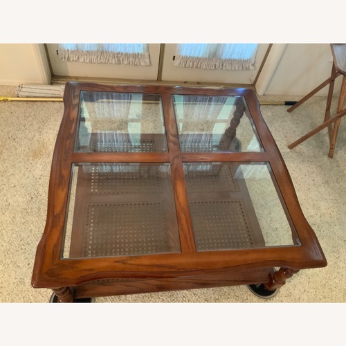 Used Dark Brown Wood Coffee Table for sale on AptDeco