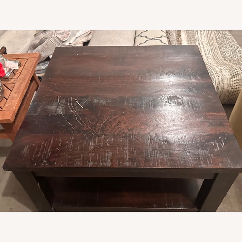 Used Dark Brown Wood Coffee Table for sale on AptDeco