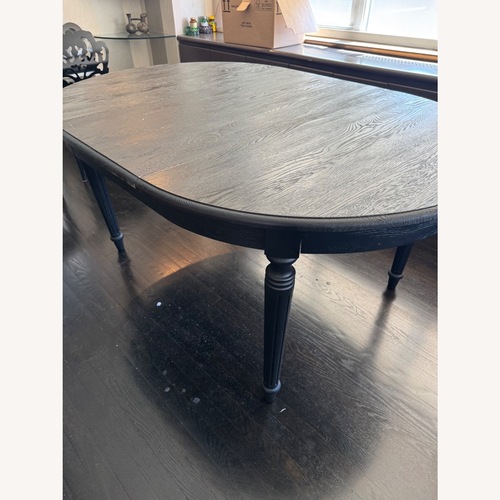 Used Black Wood Dining Table With Expansion Leaf for sale on AptDeco