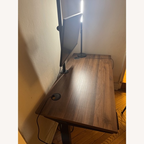 Used Uplift Standing Desk Dark Brown Metal Desk for sale on AptDeco