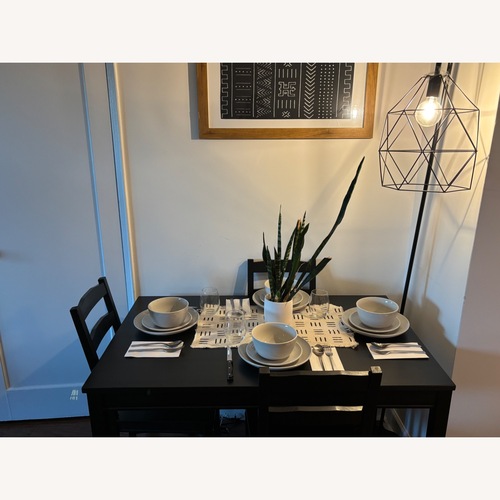 Used IKEA JOKKMOKK Black Wood Dining Table and Chairs for sale on AptDeco