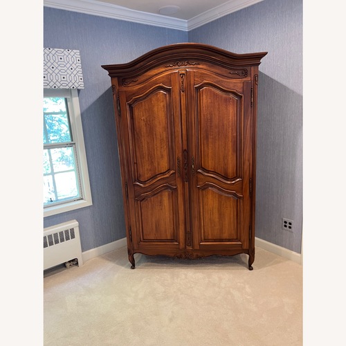 Used Dark Brown Wood Armoire for sale on AptDeco