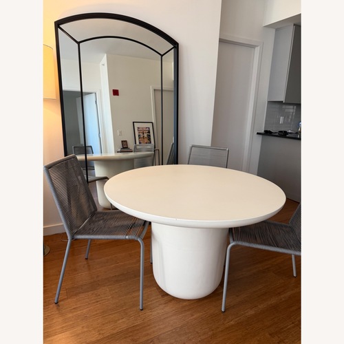 Used CB2 Lola 45" Round Ivory Concrete Dining Table for sale on AptDeco