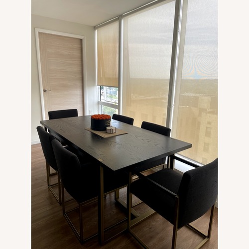 Used  Extendable Black Wood Dining Table for sale on AptDeco