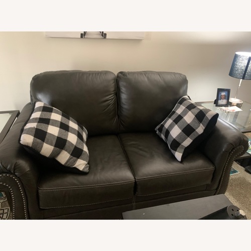 Used Dark Gray Leather Loveseat for sale on AptDeco