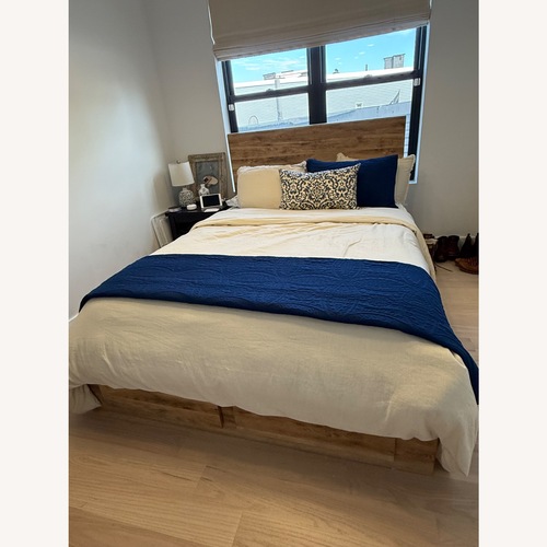 Used Ashley Furniture Hyanna Queen Bed Frame with Storage for sale on AptDeco
