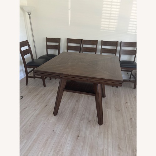 Used Costsco Square / Circular Dining Table and 6 Chairs for sale on AptDeco