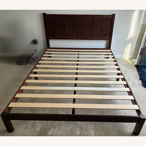 Used Rich Dark Wood Platform Bed Frame with Headboard for sale on AptDeco
