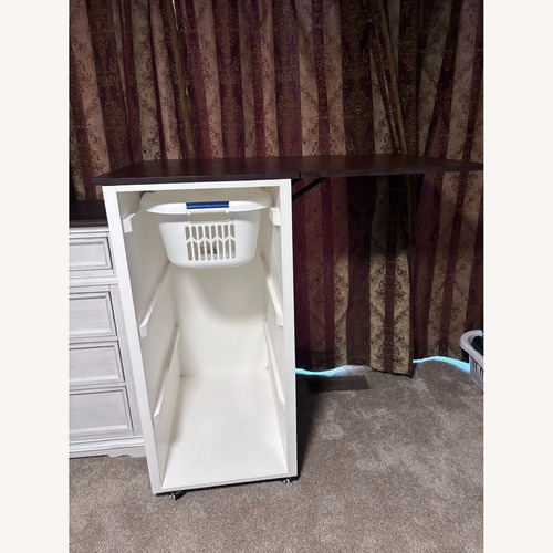 Used Laundry Cabinet (White Wood, Brown Wood Top) for sale on AptDeco