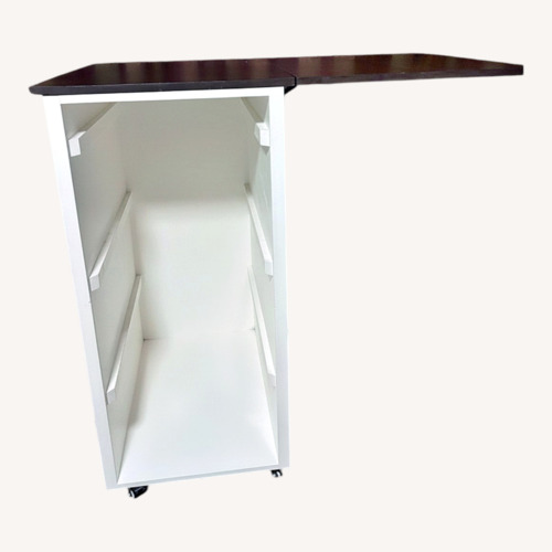 Used Laundry Cabinet (White Wood, Brown Wood Top) for sale on AptDeco
