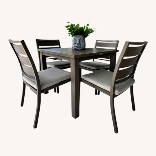 Used Light Gray Aluminum Table and Chairs for sale on AptDeco