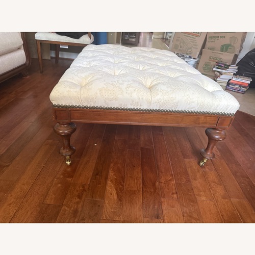Used Natural Fabric Tufted Ottoman With Wood Base for sale on AptDeco