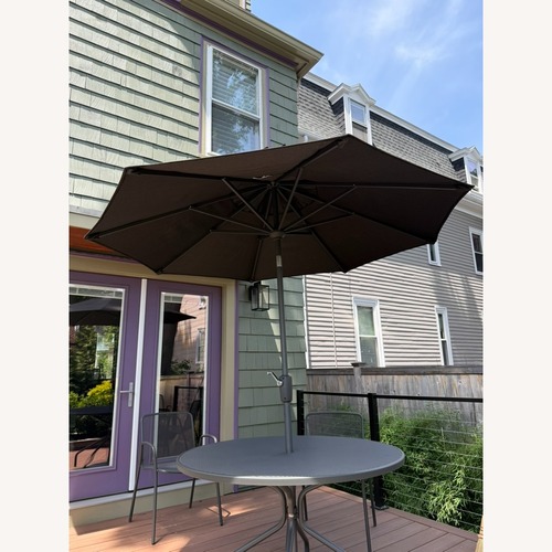 Used Room & Board Maui Dark Brown Metal Umbrella for sale on AptDeco