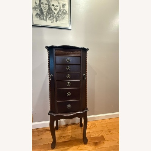 Used Dark Brown Wood Armoire for sale on AptDeco