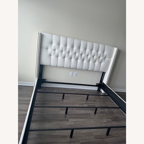Used Cornelius Wingback King-size Upholstered Bed for sale on AptDeco