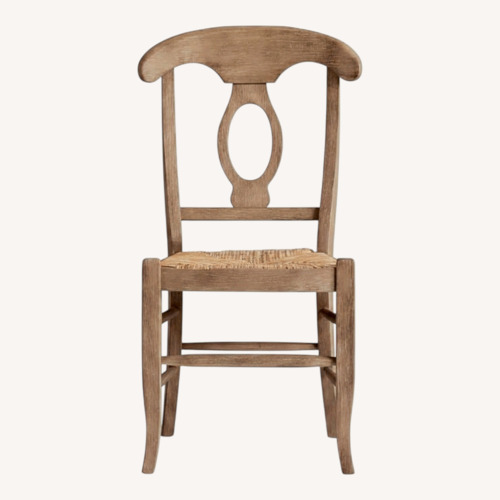 Used Pottery Barn Napoleon Natural Wood Dining Chair for sale on AptDeco