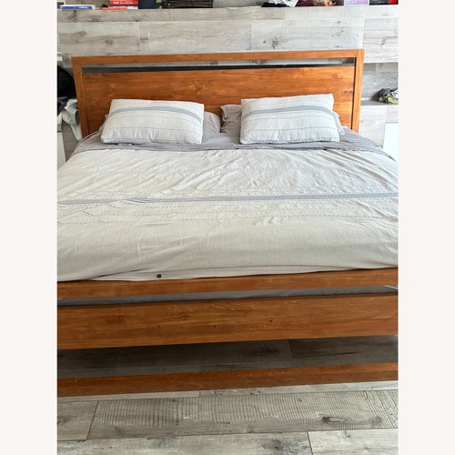Used Crate & Barrel Linea Natural Teak Wood King Bed for sale on AptDeco