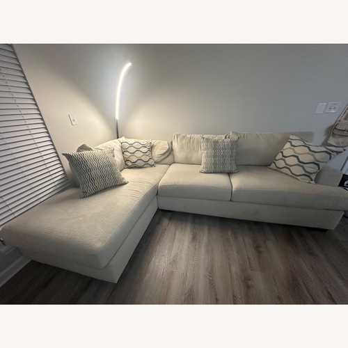 Used Rooms To Go Light Brown 2 Piece Sectional for sale on AptDeco