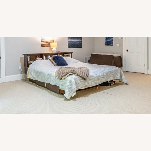 Used Dark Brown Wood CA King Bed for sale on AptDeco
