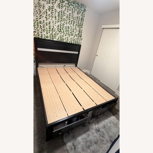 Used Black Wood Queen Bed for sale on AptDeco