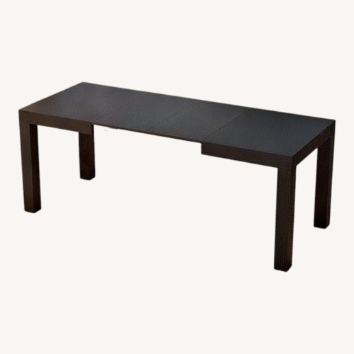Used Black Wood Veneer Dining Table for sale on AptDeco