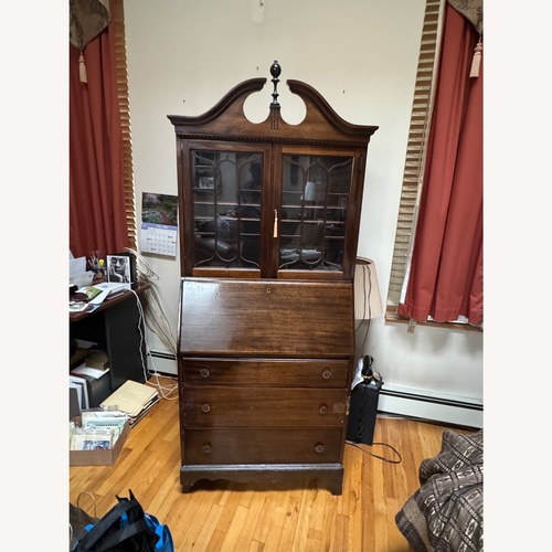 Used Vintage/Antique Dark Brown Wood Armoire for sale on AptDeco