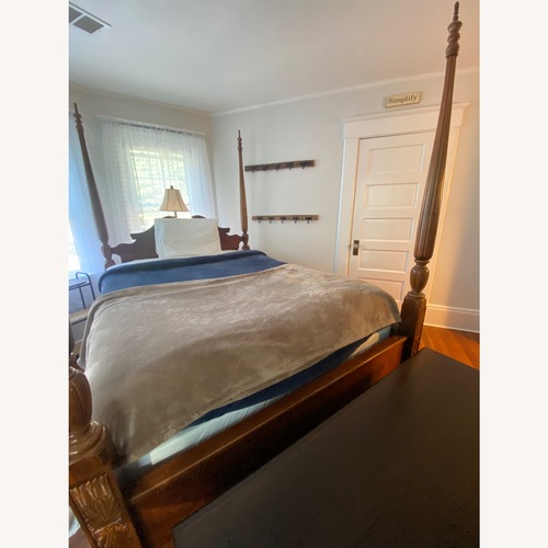Used Vintage/Antique Dark Brown Wood Queen Bed for sale on AptDeco