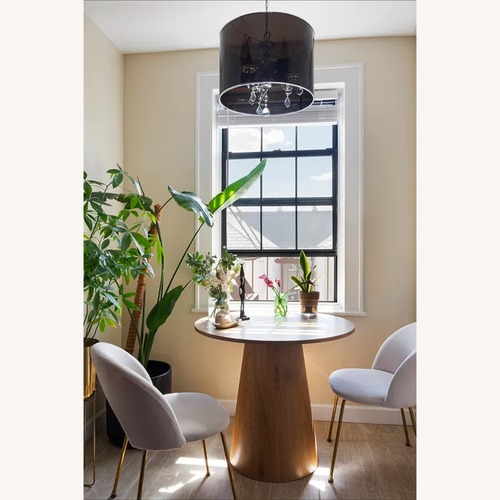 Used Modern Round Oak Pedestal Dining Table for sale on AptDeco