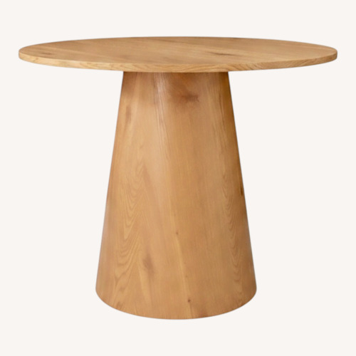 Used Modern Round Oak Pedestal Dining Table for sale on AptDeco