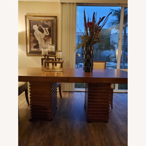 Used Tommy Bahama Peninsula Dining Table for sale on AptDeco