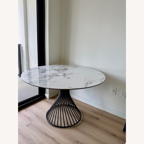 Used Calligaris Vortex Natural Marble Dining Table for sale on AptDeco