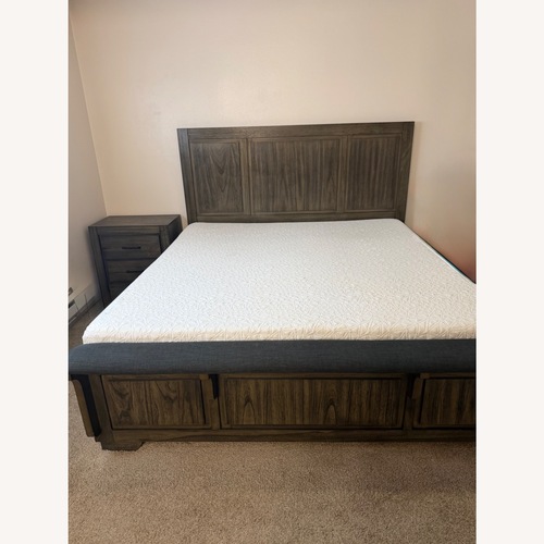 Used Ashley Furniture Dark Brown Wood King Bed for sale on AptDeco