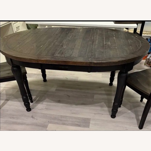 Used Ginger Round to Oval Dining Table for sale on AptDeco