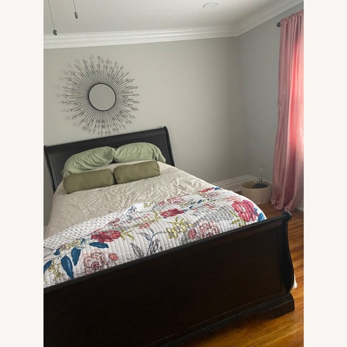 Used Dark Brown Wood Queen Bed for sale on AptDeco