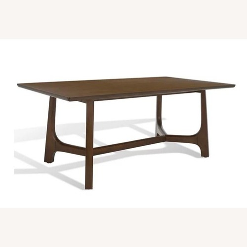 Used Safavieh Couture Dark Brown Wood Dining Table for sale on AptDeco