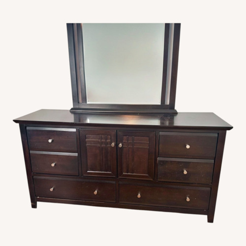 Used Raymour & Flanigan Black Wood Dresser for sale on AptDeco