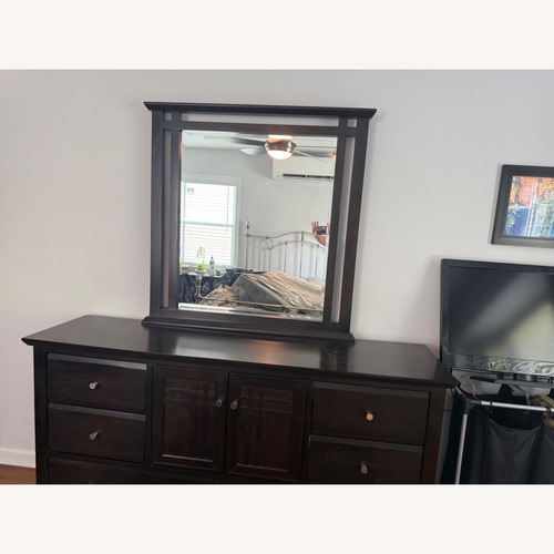 Used Raymour & Flanigan Black Wood Dresser for sale on AptDeco