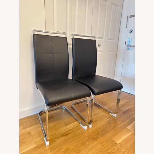 Used 2 Black Modern Dining Chairs Chrome Frame for sale on AptDeco