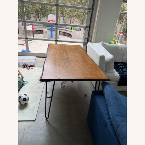 Used World Market Dark Brown Wood Dining Table for sale on AptDeco