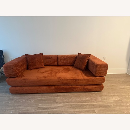 Used Orange Cotton Futon for sale on AptDeco