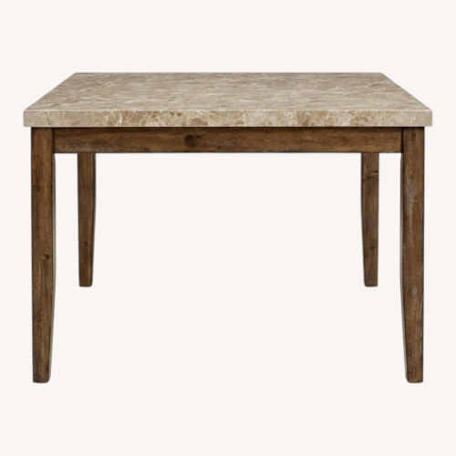 Used Steve Silver Co. Natural Wood Dining Table for sale on AptDeco