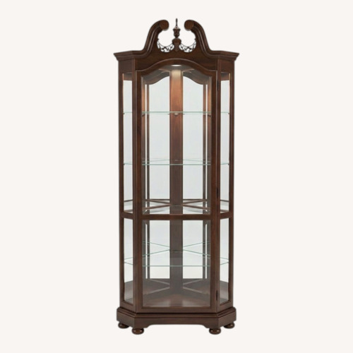Used Howard Miller Mahogany Lighted Curio Cabinet for sale on AptDeco