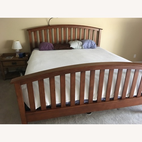 Used Palisade Furniture Natural Wood King Bed Frame for sale on AptDeco
