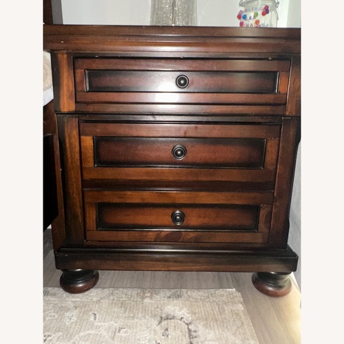 Used Ashley Furniture Porter Dark Brown Wood Nightstands for sale on AptDeco