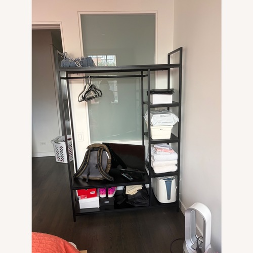 Used Freestanding Closet Organizer Black Metal Armoire for sale on AptDeco