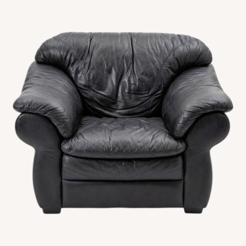 Used Black Leather One Seater & Ottoman for sale on AptDeco