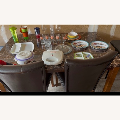 Used Ashley Furniture Dark Brown Wood Dining Table for sale on AptDeco